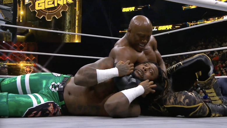 Lashley wearing down Strickland with a submission hold