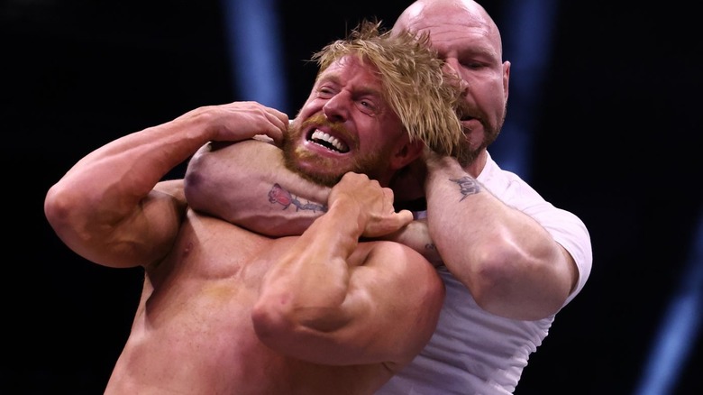 Jon Moxley choking Orange Cassidy