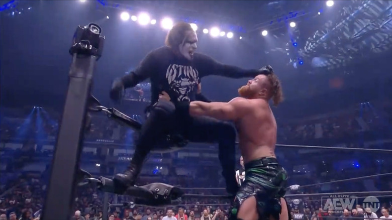 Sting hitting Matthews with a forearm