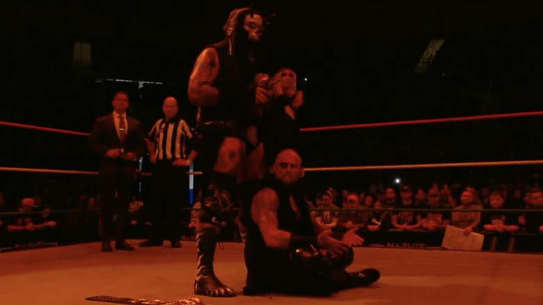 Kings of the Black Throne and Julia Hart in the ring