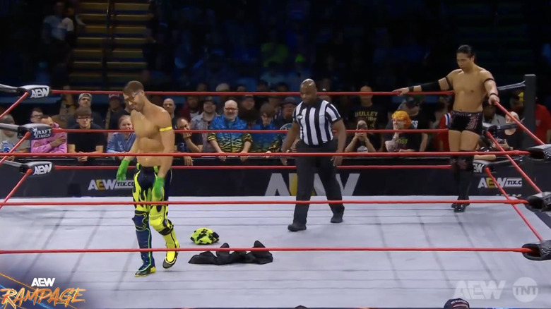 Angelico and Takeshita in the ring