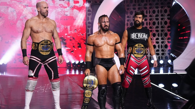 Blackpool Combat Club and PAC with their trios titles