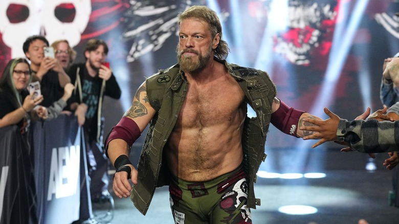 Cope stares straight ahead as he high-fives people during his entrance.