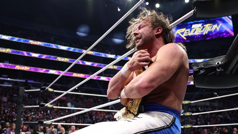 Kenny Omega clutches the AEW International Title