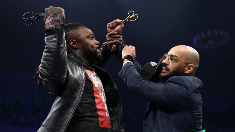 Swerve Strickland and Ricochet go after each other with scissors in their hands in the middle of the ring on "AEW Dynamite."