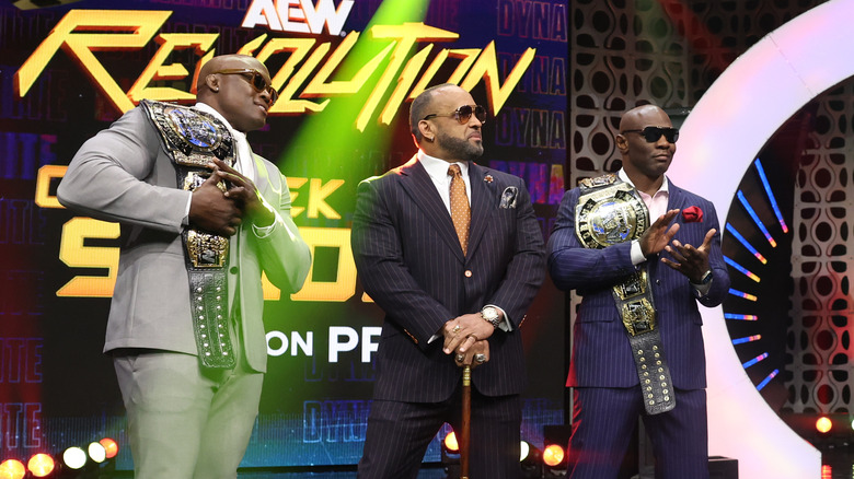 The Hurt Syndicate's Bobby Lashley, Shelton Benjamin, and MVP stare and clap for the Outrunners on the stage following their victory on "AEW Dynamite."