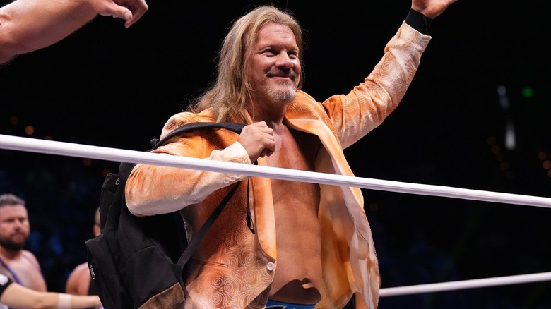 Chris Jericho wearing an orange jacket