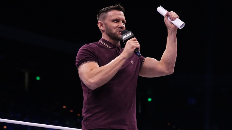 Nigel McGuinness brandishes the contract for his match