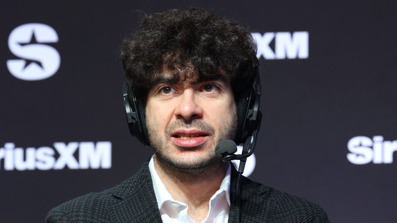 Tony Khan wearing that headset