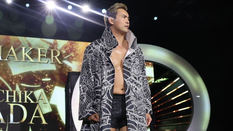 Kazuchika Okada watches on as he makes his entrance.