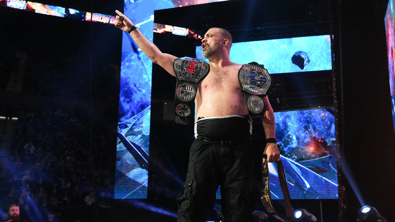 Eddie Kingston with all three title belts