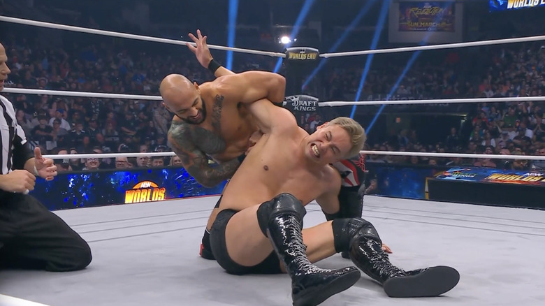 Ricochet with a submission locked in on Okada