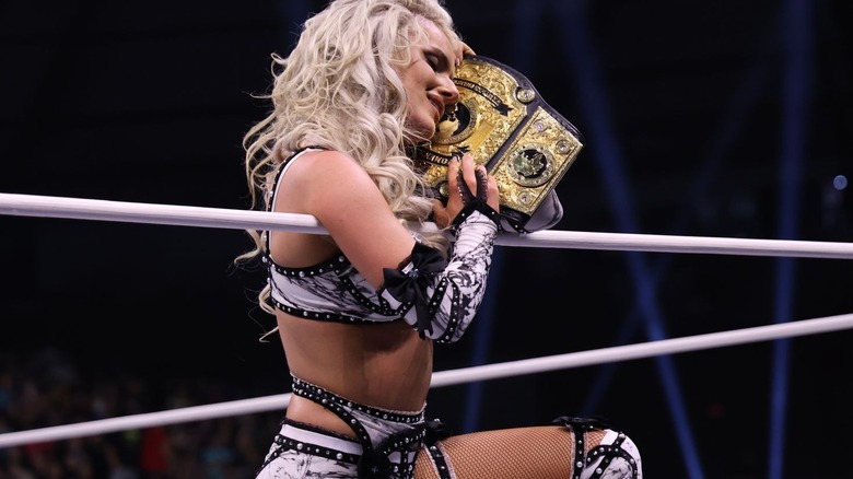 Mariah May cradles her title belt