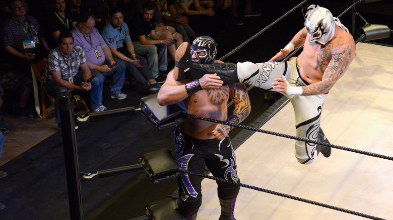 Rey Fenix kicks his opponent in the face