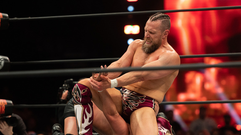 Bryan Danielson puts his opponent in a submission hold