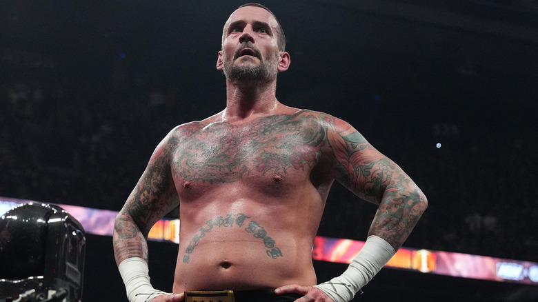 CM Punk with hands on hips