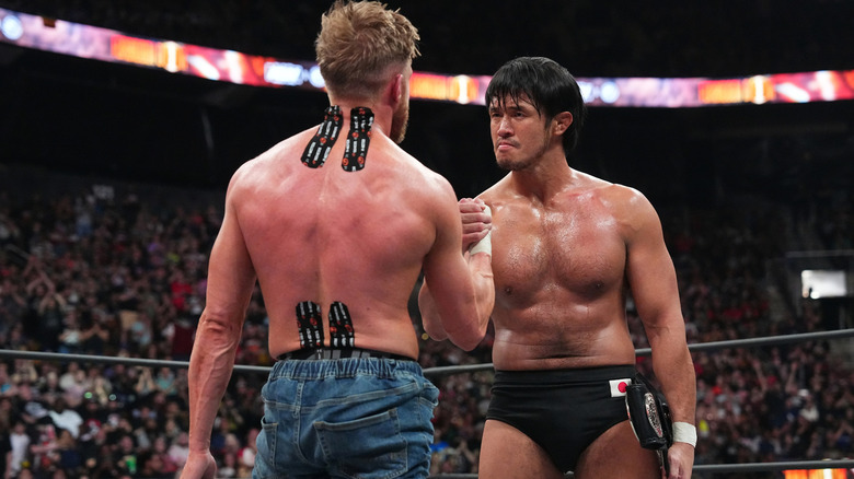 Orange Cassidy shakes hands with Shibata