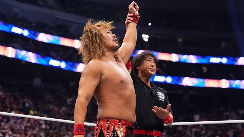 Tetsuya Naito with arm raised