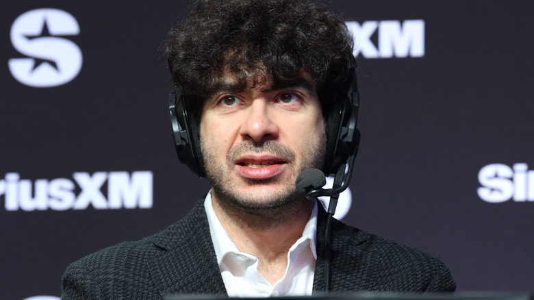 Tony Khan wearing a headset