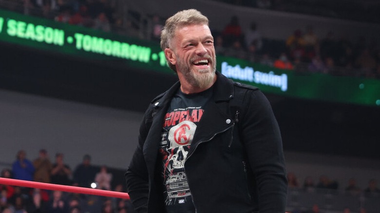 Adam Copeland laughing in the middle of an AEW ring