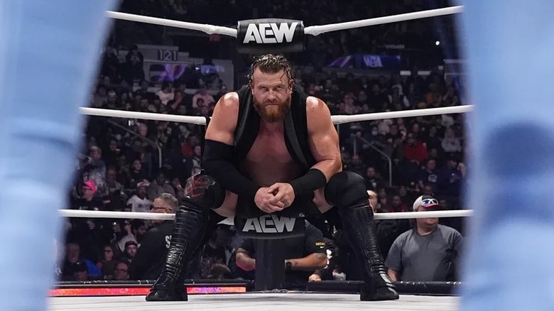 Buddy Matthews sizes up his opponent before squaring up in an AEW match