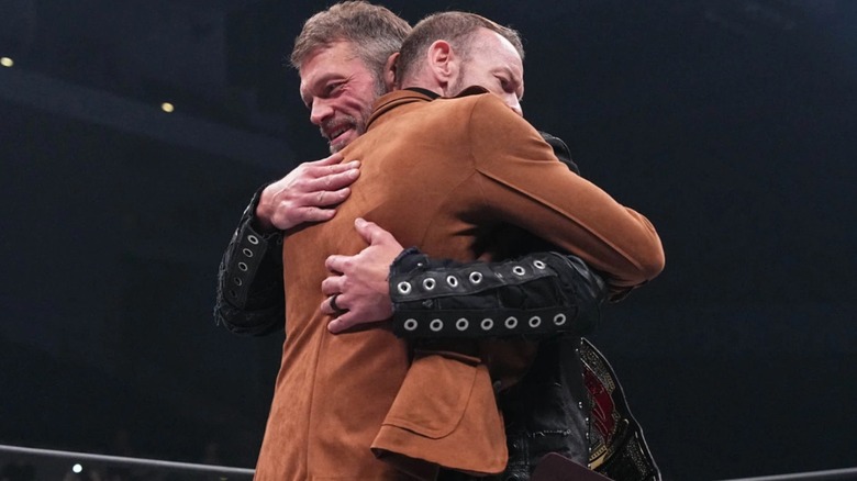 Adam Copeland and Christian Cage hugging before the infamous line