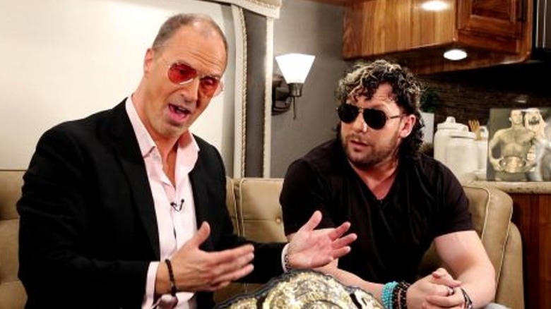 Don Callis and Kenny Omega with the AEW World Championship