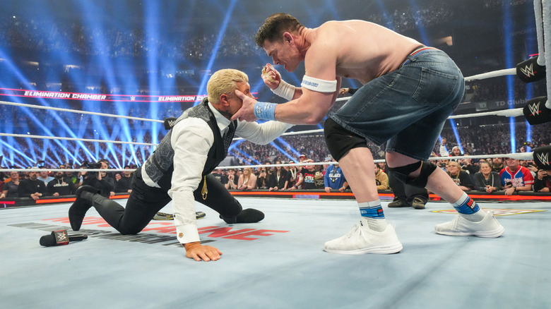 John Cena attacking Cody Rhodes at Elimination Chamber