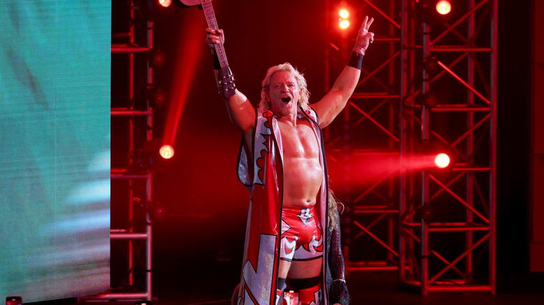 Jeff Jarrett holding up a guitar making his entrance