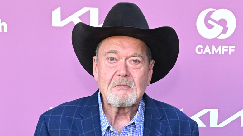 Jim Ross poses for cameras at a red carpet event