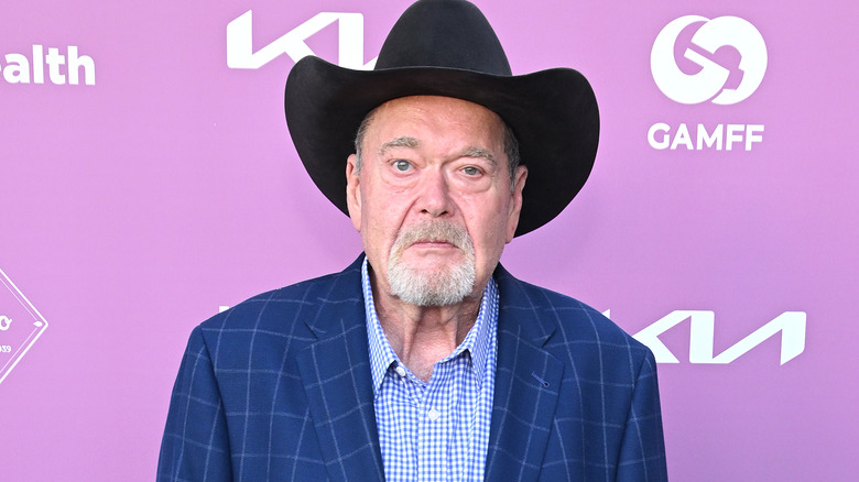 Jim Ross wearing a black cowboy hat