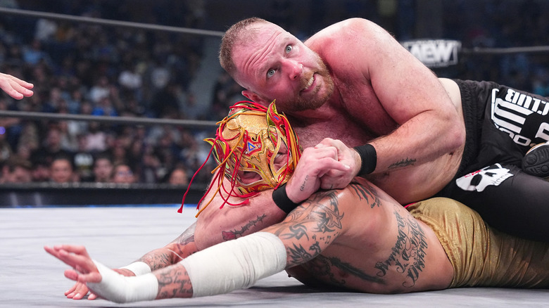 Jon Moxley applies a hold