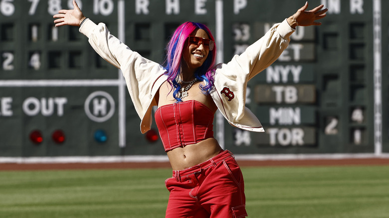 Mercedes Mone posing at a baseball stadium