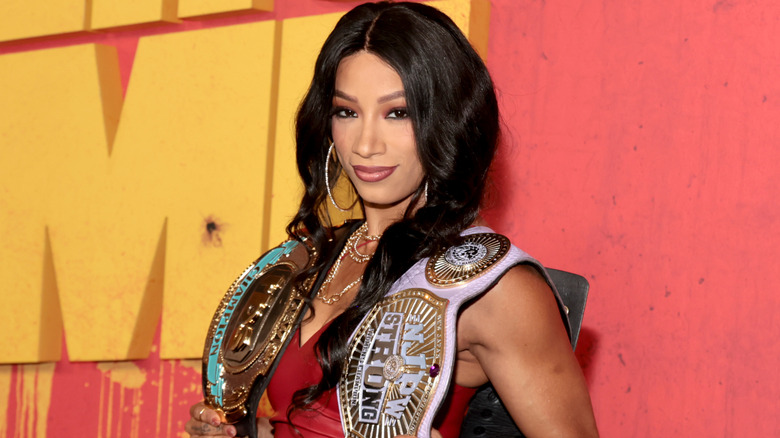 Mercedes Mone holding the TBS and NJPW STRONG Women's Championships