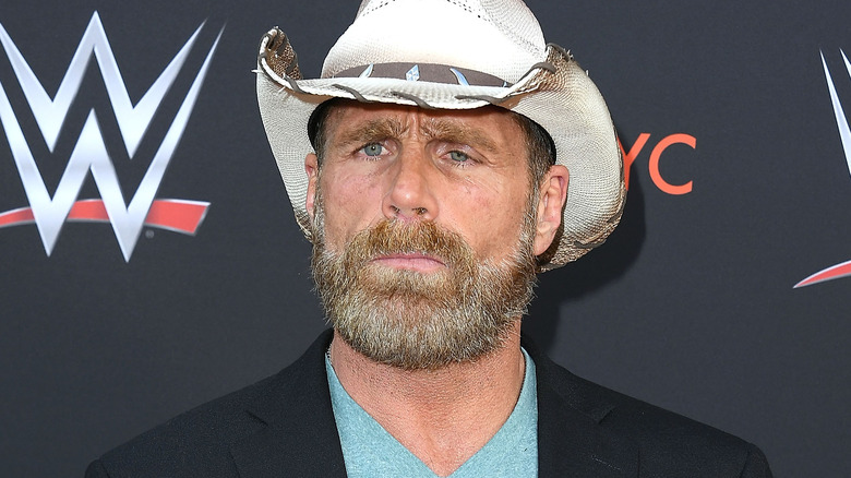 Shawn Michaels is wearing a white cowboy hat.