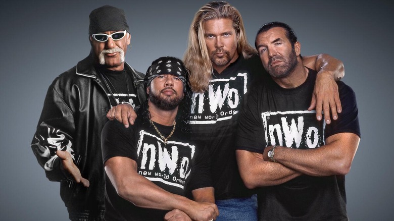 Hulk Hogan, X-Pac, Kevin Nash, and Scott Hall posing with their nWo attire