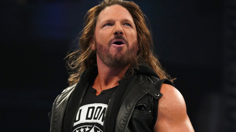 AJ Styles wearing a black vest