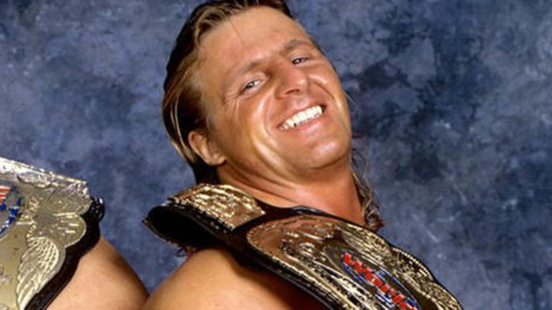 Owen Hart posing with belt