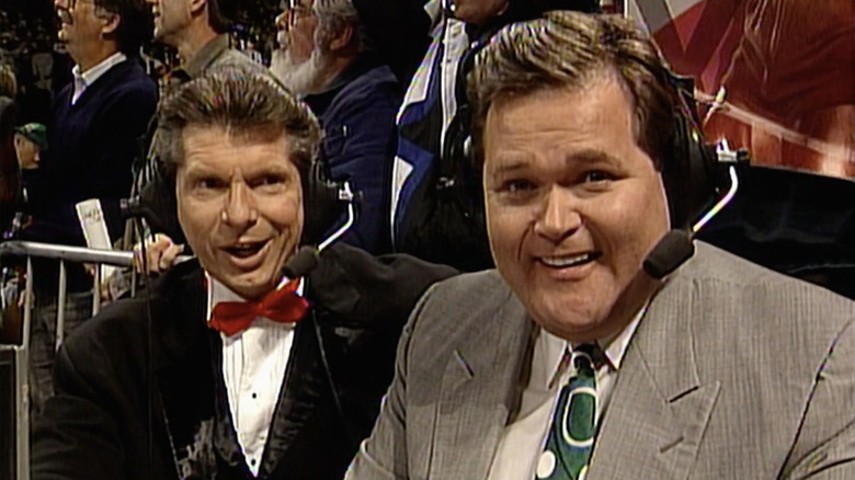 Vince McMahon and Jim Ross smile