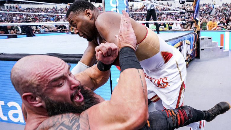 Angelo Dawkins tackling Braun Strowman