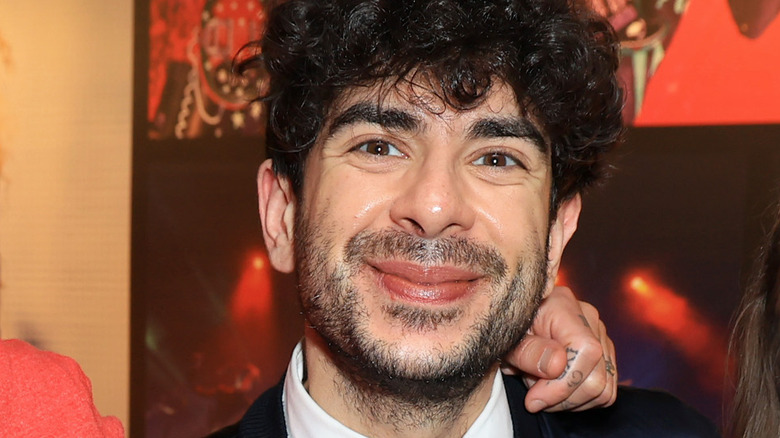 Tony Khan smiles