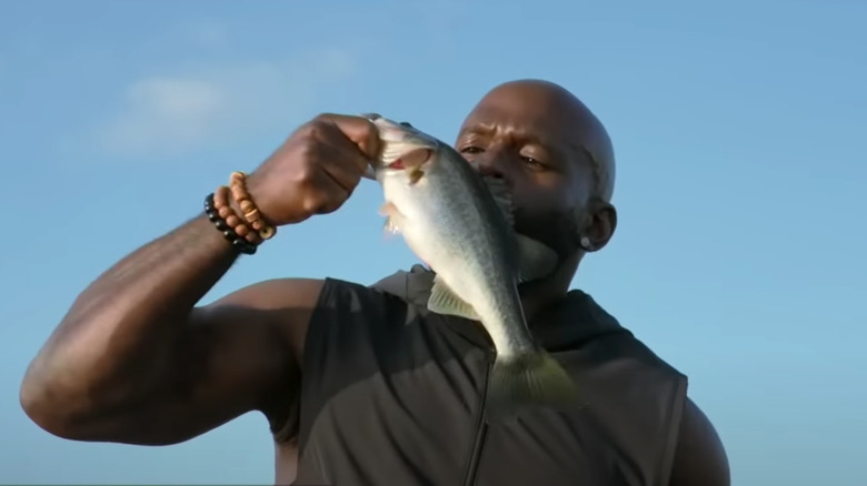 Apollo Crews kisses fish