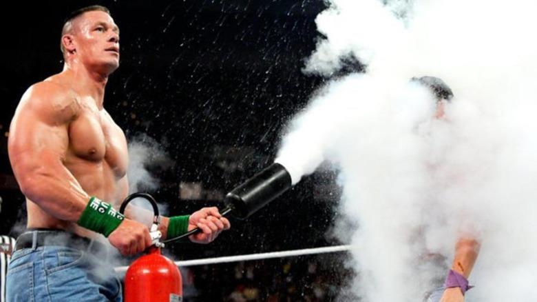John Cena using a fire extinguisher