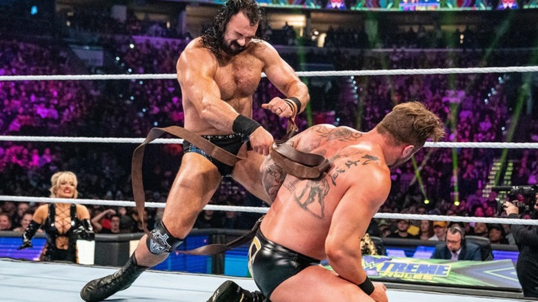 Drew McIntyre whips Karrion Kross with a Strap