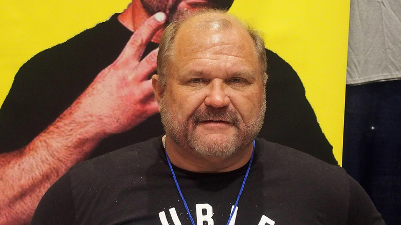 Arn Anderson playing it cool, aware that a younger Arn Anderson is behind him and ready to whoop him