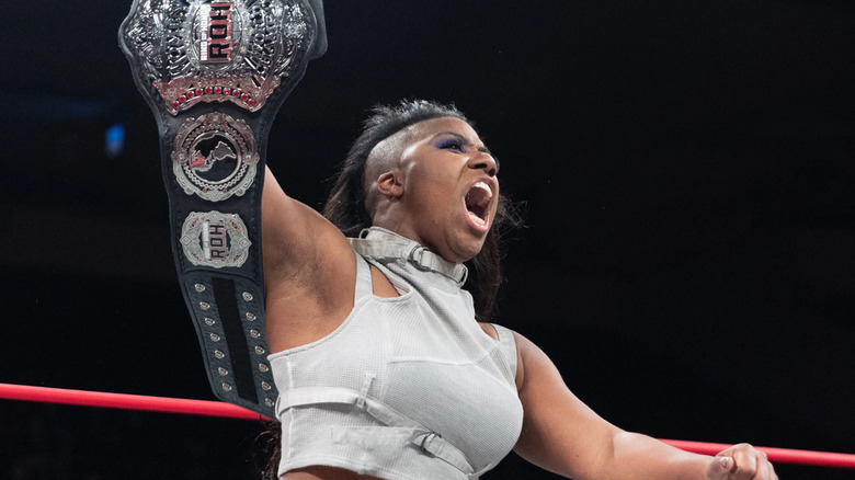 Athena holds up the Ring of Honor Women's Title