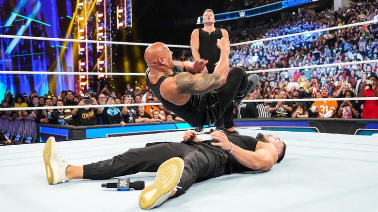 The Rock landing the People's Elbow on Austin Theory