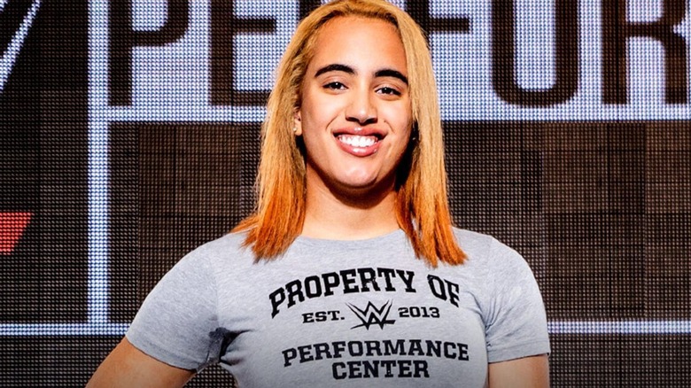 Simone Johnson poses for a camera to announce her signing with WWE and reporting to its Performance Center.