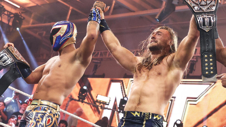 Nathan Frazer and Axiom celebrate their "NXT" Tag Team Championship win.