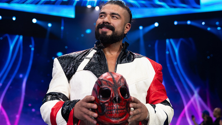 Andrade El Idolo carries his entrance mask